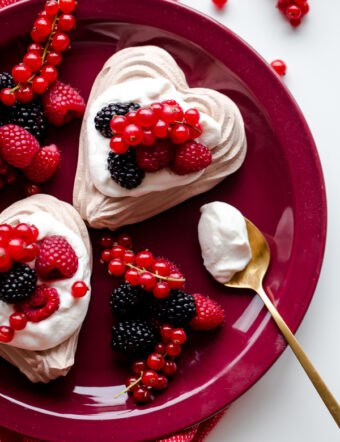 Chocolate Heart Meringue Cups with Whipped Cream and Berries. An elegant, simple dessert for Valentine's Day!